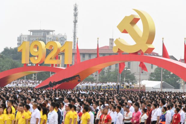 People attend the celebrations of the 100th anniversary of the founding of the Communist Party of China at Tiananmen Square in Beijing on July 1, 2021. (Photo by WANG Zhao / AFP)