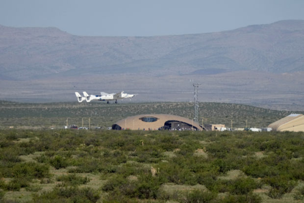  Virgin Galactic's VMS Eve carries the VSS Unity on takeoff from Spaceport America, July 11, 2021 in Truth Or Consequences, New Mexico. Aboard VSS unity are pilots Dave Mackay and Michael Masucci, and mission specialists Sirisha Bandla, British billionaire and founder of Virgin Galactic Sir Richard Branson, Colin Bennett, and Beth Moses. The VSS Unity is scheduled to travel to an altitude of over 50 miles above the Earth.   David Lienemann/Getty Images/AFP (Photo by David Lienemann / GETTY IMAGES NORTH AMERICA / Getty Images via AFP)