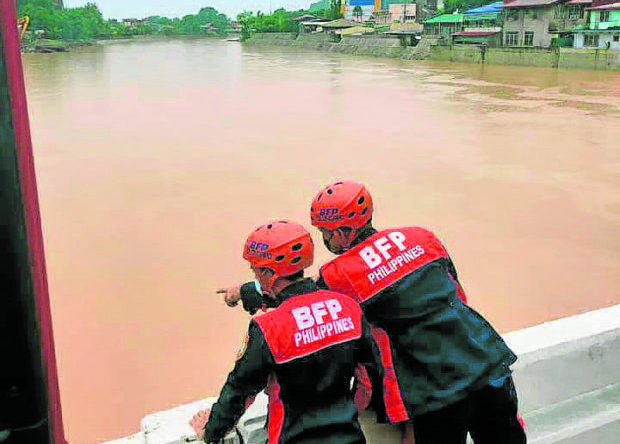 Firefighters surveying river in Olongapo City