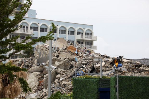 Debris is seen after the managed demolition of the remaining part of Champlain Towers South complex as search-and-rescue efforts continue in Surfside, Florida,