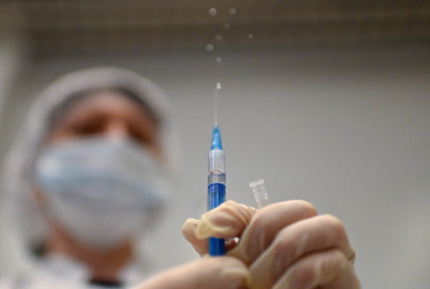  A healthcare worker prepares a dose of Sputnik V (Gam-COVID-Vac) vaccine against the coronavirus disease (COVID-19) in a vaccination centre at a shopping mall in Omsk, Russia, June 29, 2021.