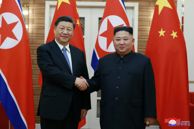 North Korean leader Kim Jong Un shakes hands with China's President Xi Jinping during Xi's visit in Pyongyang, North Korea in this undated photo released on June 21, 2019 by North Korea's Korean Central News Agency (KCNA).  KCNA via REUTERS
