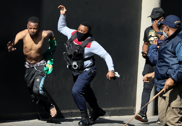 Violence spreads to South Africa's economic hub in wake of Zuma jailing, in Johannesburg