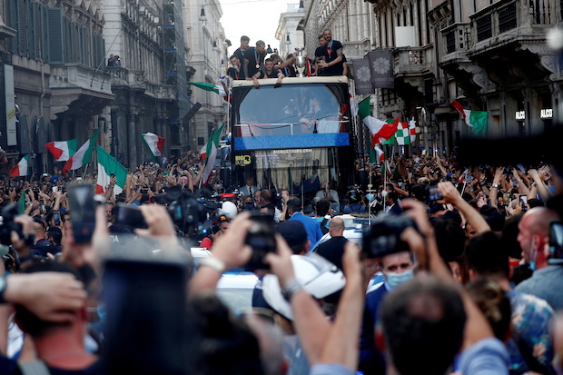 Soccer Football - Euro 2020 - The Italy team drive through Rome on a open top bus tour amidst celebrating fans after winning the Euros 2020
