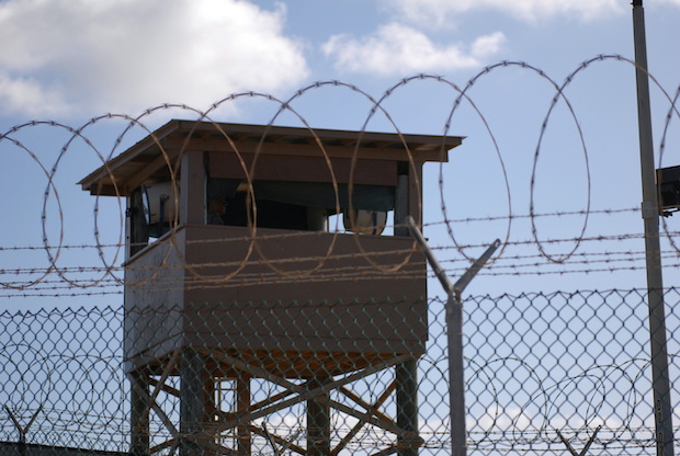 File photo of a soldier standing guard in a tower overlooking Camp Delta  at Guantanamo Bay naval base