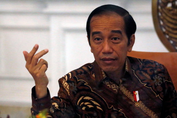 Indonesian President Joko Widodo gestures during an interview with Reuters at the presidential palace in Jakarta, Indonesia, November 13, 2020