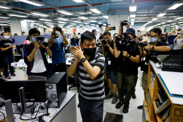 Four Apple Daily staff due in Hong Kong court on national security charges