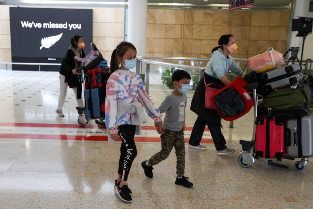 Passengers arrive from New Zealand after the Trans-Tasman travel bubble opened overnight, at Sydney Airport