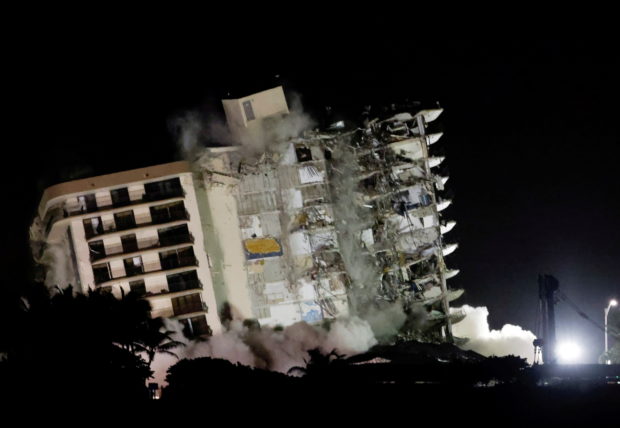 The partially collapsed Champlain Towers South residential building is demolished, in Surfside, Florida, July 4, 2021. REUTERS/Marco Bello/File Phot