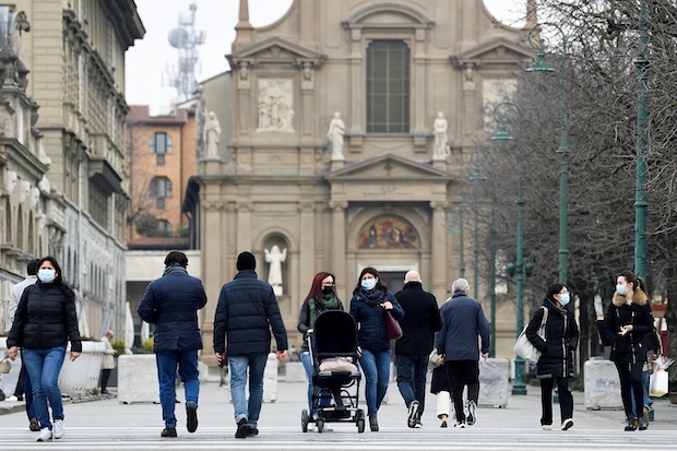 People walking on a street in Bergamo