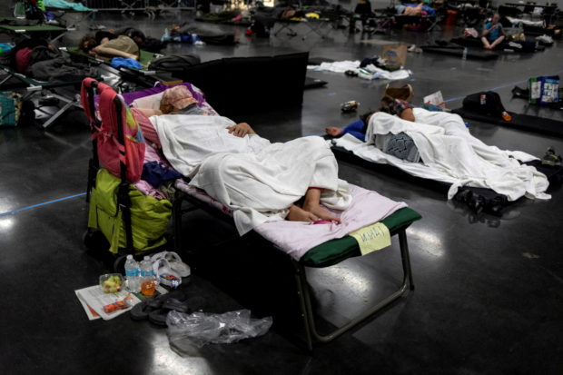 People sleep at a cooling shelter set up during an unprecedented heat wave in Portland, Oregon, U.S. June 27, 2021. 