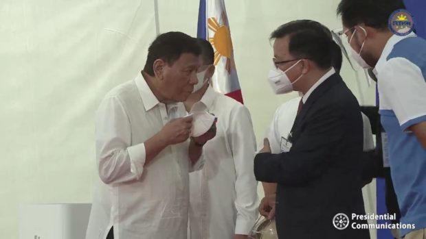 President Rodrigo Duterte speaks with Chinese Ambassador to the Philippines Huang Xilian during the inauguration of the Estrella-Pantaleon Bridge connecting Makati and Mandaluyong. Screengrab from RTVM