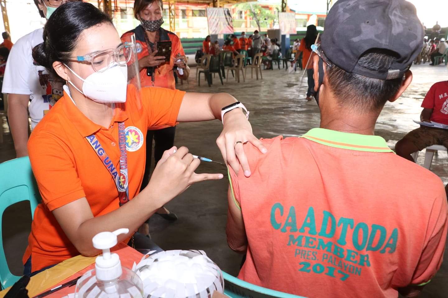 A tricycle driver receives his first Moderna shot during a vaccination drive held at Camarin D Elementary School in Caloocan City. PHOTO COURTESY OF CALOOCAN PIO