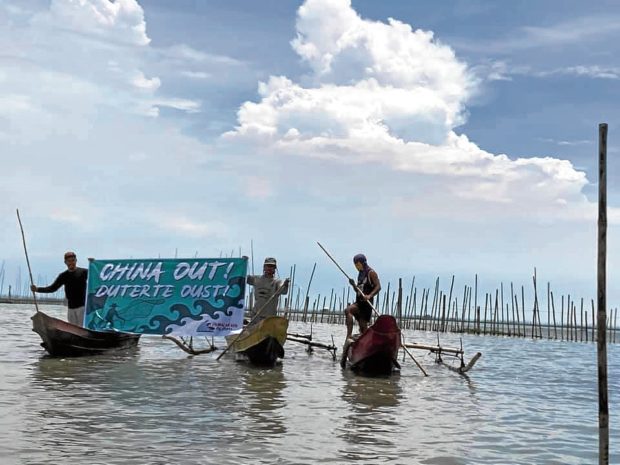 DISMAYED In a protest on June 12, Independence Day, fishermen in Botolan, Zambales, express their dismay over the way the government is handling the territorial dispute with China in the West Philippine Sea. —PHOTO COURTESY OF PAMALAKAYA