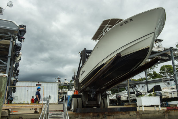 Boats are taken out of the water and placed on land by crews at Safe Harbor Marina in preparation for the impeding Tropical storm Henri expected to make landfall as a Hurricane on Sunday, in Buzzards Bay, Massachusetts on August 20, 2021. - A swath of the US east coast, including New York City, was under alert Friday due to approaching storm Henri, which is expected to become the first hurricane to hit the New England area in decades. Forecasters warned of violent winds, the risk of flash floods and surging seas as the storm churned in the Atlantic, with landfall expected on Sunday. 
