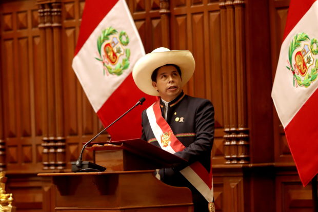 Peru's new President Pedro Castillo addresses the law makers and invitees during the Inauguration Day at the Congress in Lima, Peru July 28, 2021. 