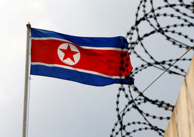  A North Korea flag flutters next to concertina wire at the North Korean embassy in Kuala Lumpur, Malaysia