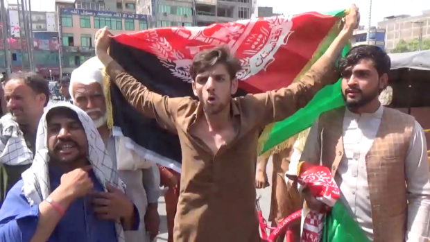 People carry Afghan flags as they take part in an anti-Taliban protest in Jalalabad, Afghanistan August 18, 2021 in t