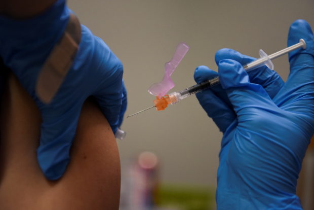 A person receives a COVID-19 vaccine at Floyd's Family Pharmacy as cases of the coronavirus disease (COVID-19) surge in Ponchatoula, Louisiana, U.S., August 5, 2021.REUTERS/Callaghan O'Hare/File Photo
