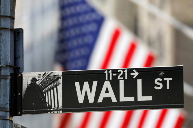 A street sign for Wall Street is seen outside the New York Stock Exchange (NYSE) in New York City, New York, U.S., July 19, 2021