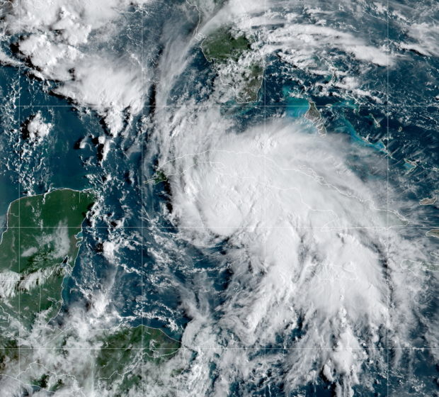 A satellite image shows Tropical Storm Ida after forming in the Caribbean, about 75 miles (125 kilometers) north-northwest of Grand Cayman, August 27, 2021. NOAA/via REUTERS