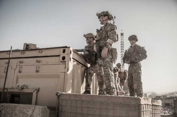 U.S. service members assist at an Evacuation Control Check Point (ECC) during an evacuation at Hamid Karzai International Airport, Kabul, Afghanistan, August 26, 2021. 