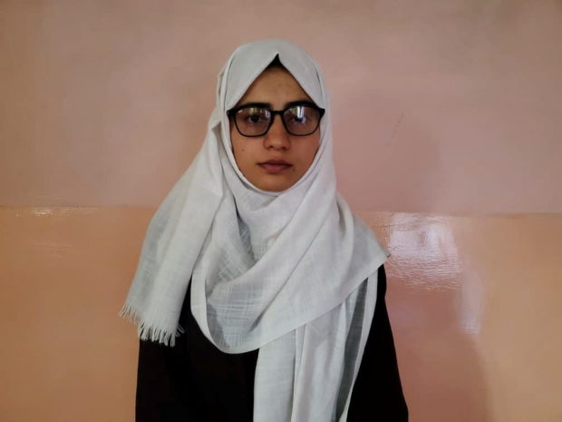 Salgy, 20, poses for a photo after topping Afghanistan's university entrance exams, in Kabul, Afghanistan August 26, 2021 in this handout picture obtained by Reuters