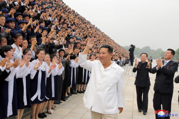 North Korean leader Kim Jong Un attends a photo session with participants during Youth Day celebrations, in Pyongyang