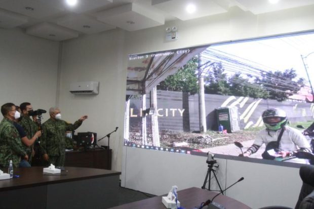 PNP chief Guillermo Eleazar at Camp Crame on Monday oversaw the live feed of a body worn camera deployed in a checkpoint. Photo courtesy of Philippine National Police