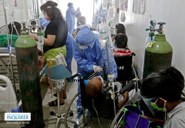 Health workers and patients inside the emergency room of Ospital ng Imus, Cavite