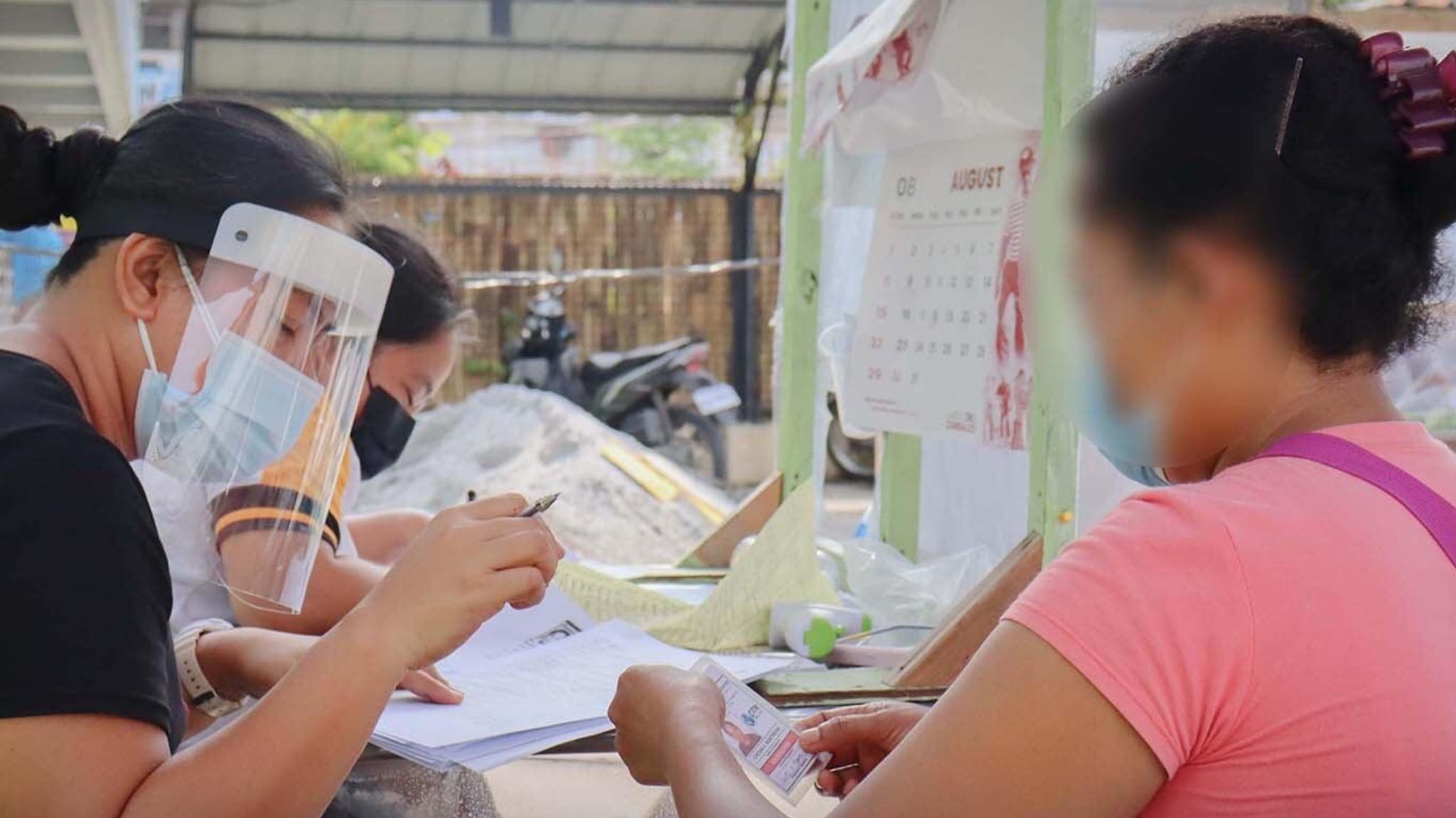 Healthcare workers in Zambales province prepare to vaccinate some of the local essential workers. (Photo courtesy of San Marcelino public information office)