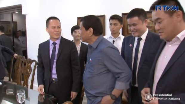 Former presidential adviser on economic affairs Michael Yang with President Duterte during a meeting with officials of Pharmally Pharmaceuticals in Davao City. Image from the March 18, 2017 video of RTVM Malacañang