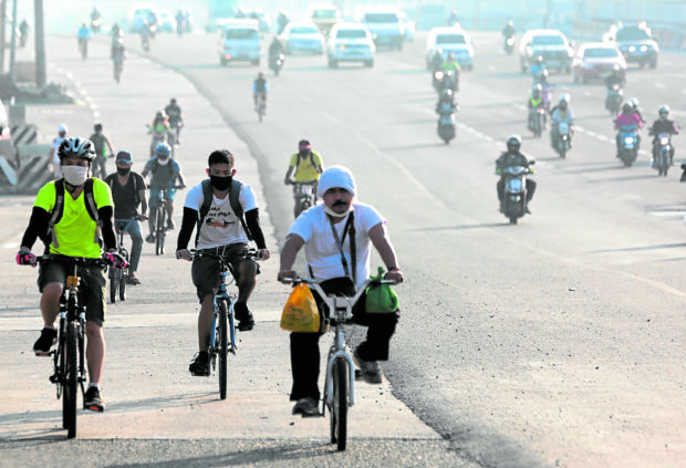 PHOTO: Bikers on the road. STORY: DILG urges more active transport projects.