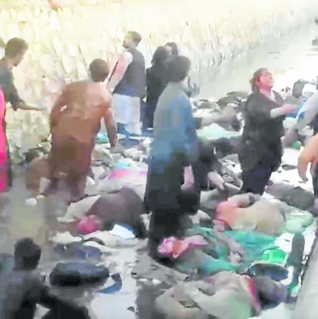 A video shows the dead and injured scattered outside the Kabul airport, following Thursday’s suicide bombing