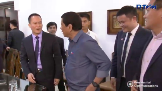 Former presidential adviser on economic affairs Michael Yang with President Duterte during a meeting with officials of Pharmally Pharmaceuticals in Davao City. Image from the March 18, 2017 video of RTVM Malacañang 