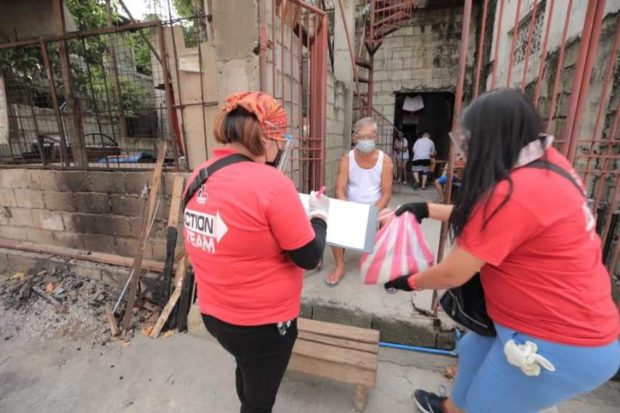 Taguig City residents get food packs from local gov't as two-week ECQ starts