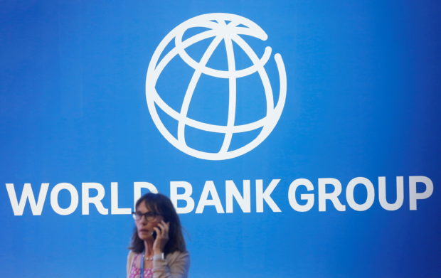 The World Bank Group logo is seen on the building of the Washington-based global development lender in Washington on January 17, 2019. - World Bank current President Jim Yong Kim announced on January 7, 2019, that he would cut short his tenure as president more than three years before his second term was to end. The World Bank Board said it would start accepting nominations for a new leader early next month and name a replacement for Kim by mid-April 2019. (Photo by Eric BARADAT / AFP)