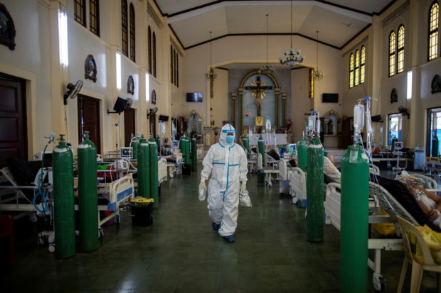 Chapel turned COVID-19 ward amid rising COVID-19 infections in the Philippines; oxygen tanks, health care worker, hospital, isolation facility