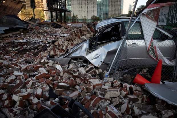 A destroyed car is seen under the debris of a building after Hurricane Ida made landfall in Louisiana, U.S.,