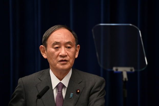 FILE PHOTO: Japan's Prime Minister Yoshihide Suga holds a news conference, in Tokyo