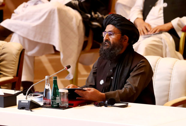 FILE PHOTO: Mullah Abdul Ghani Baradar, the leader of the Taliban delegation, speaks during talks between the Afghan government and Taliban insurgents in Doha, Qatar September 12, 2020. REUTERS/Ibraheem al Omari; Doha hosts intra-Afghan talks