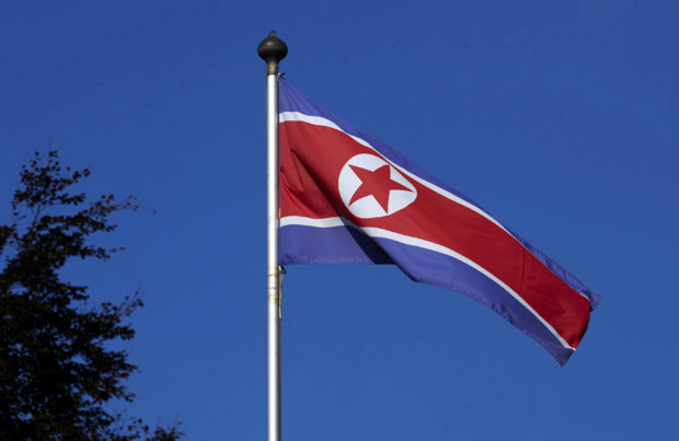 A North Korean flag flies on a mast at the Permanent Mission of North Korea in Geneva October 2, 2014. REUTERS/Denis Balibouse/File Picture