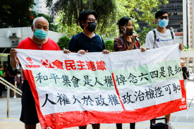 Nine HK activists get 6-10 months in prison for unauthorized Tiananmen vigil