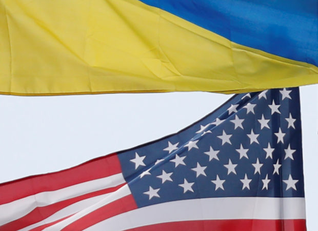 Ukrainian and U.S. state flags fly in Kiev