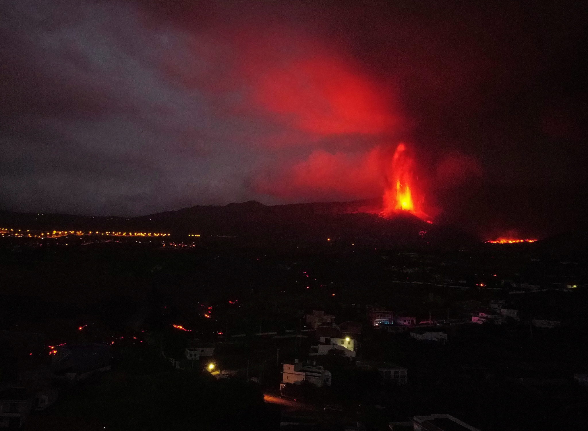 Lava shoots into the sky as La Palma volcano keeps thousands from their