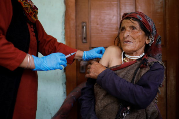 Doctors scale rockslides, invoke gods to vaccinate Himalayan villages