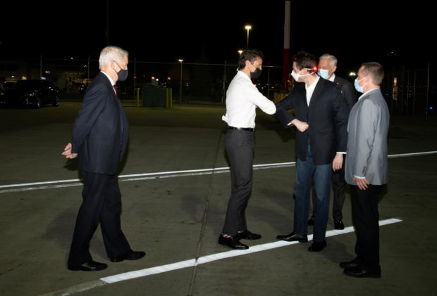  Michael Kovrig and Michael Spavor, accompanied by Canada's Ambassador to China, Domenic Barton, are greeted on arrival by Prime Minister Justin Trudeau after being released from detention in China, in Calgary, Alberta, Canada September 25, 2021.  