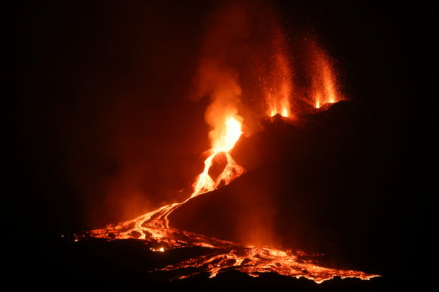 Lava and smoke rise following the eruption of a volcano on the Canary Island of La Palma, in Todoque, Spain, September 27, 2021. 