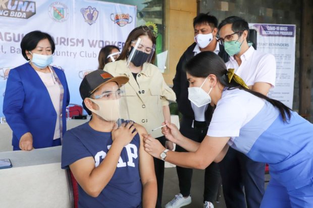 Tourism Secretary Berna Romulo-Puyat and National Task Force Against COVID-19 Deputy Chief Implementer Secretary Vince Dizon witness the inoculation of the tourism workers in Baguio City on Wednesday. PHOTO COURTESY OF DEPARTMENT OF TOURISM