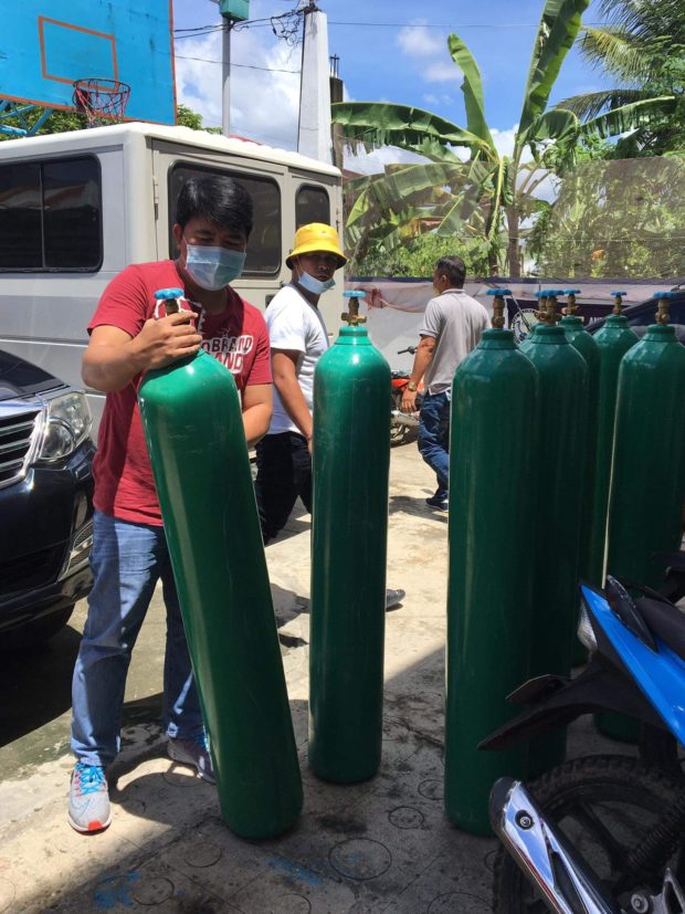 The municipality of General Luna in Quezon province receives 10 medical oxygen tanks it purchased from a Manila-based supplier for use by residents stricken with COVID-19